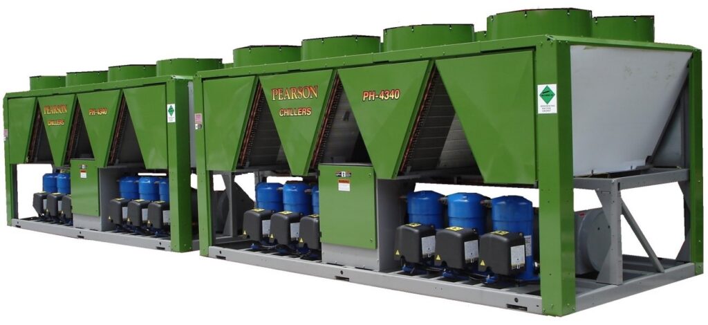 Two large industrial green Pearson water chillers with visible fans, compressors, and control boxes, labeled Pearlcox Chillers PH-4300, used for cooling applications in commercial or industrial facilities.